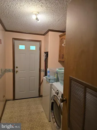 a view of a storage & utility room with utility room