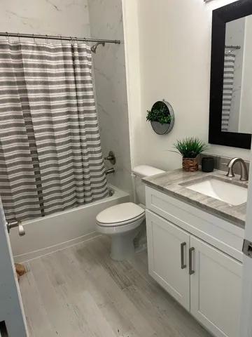 a view of hallway with window and stairs