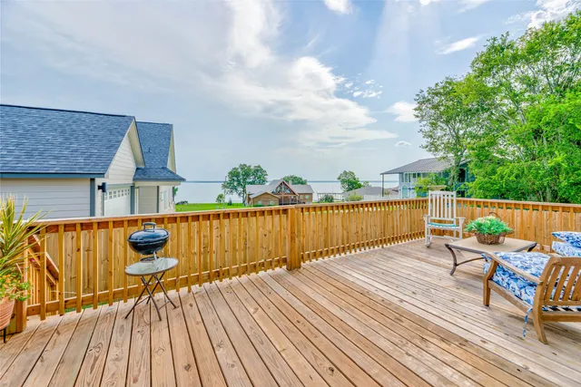 a view of a house with a yard and sitting area