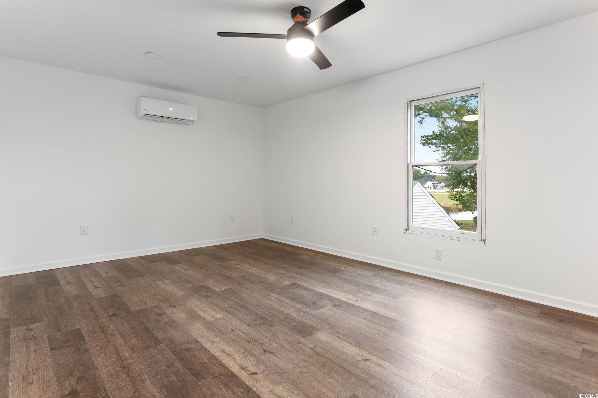 2321 Brick Drive Longs, SC 29568 - Photo 37 of 40 Empty room featuring wood finished floors and a ceiling fan