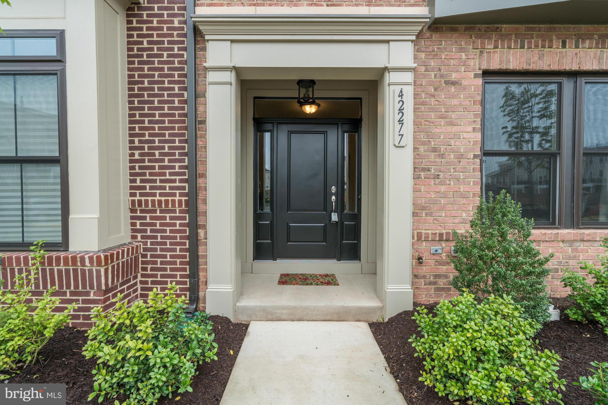 42277 Riggins Ridge Terrace Ashburn, VA 20148 - Photo 2 of 30 front view of a house with a glass door