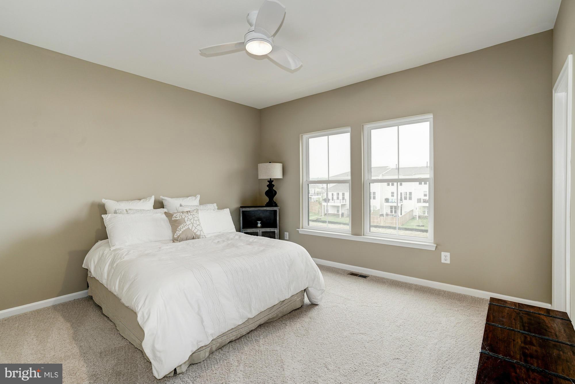 42277 Riggins Ridge Terrace Ashburn, VA 20148 - Photo 21 of 30 a bedroom with a bed and a window