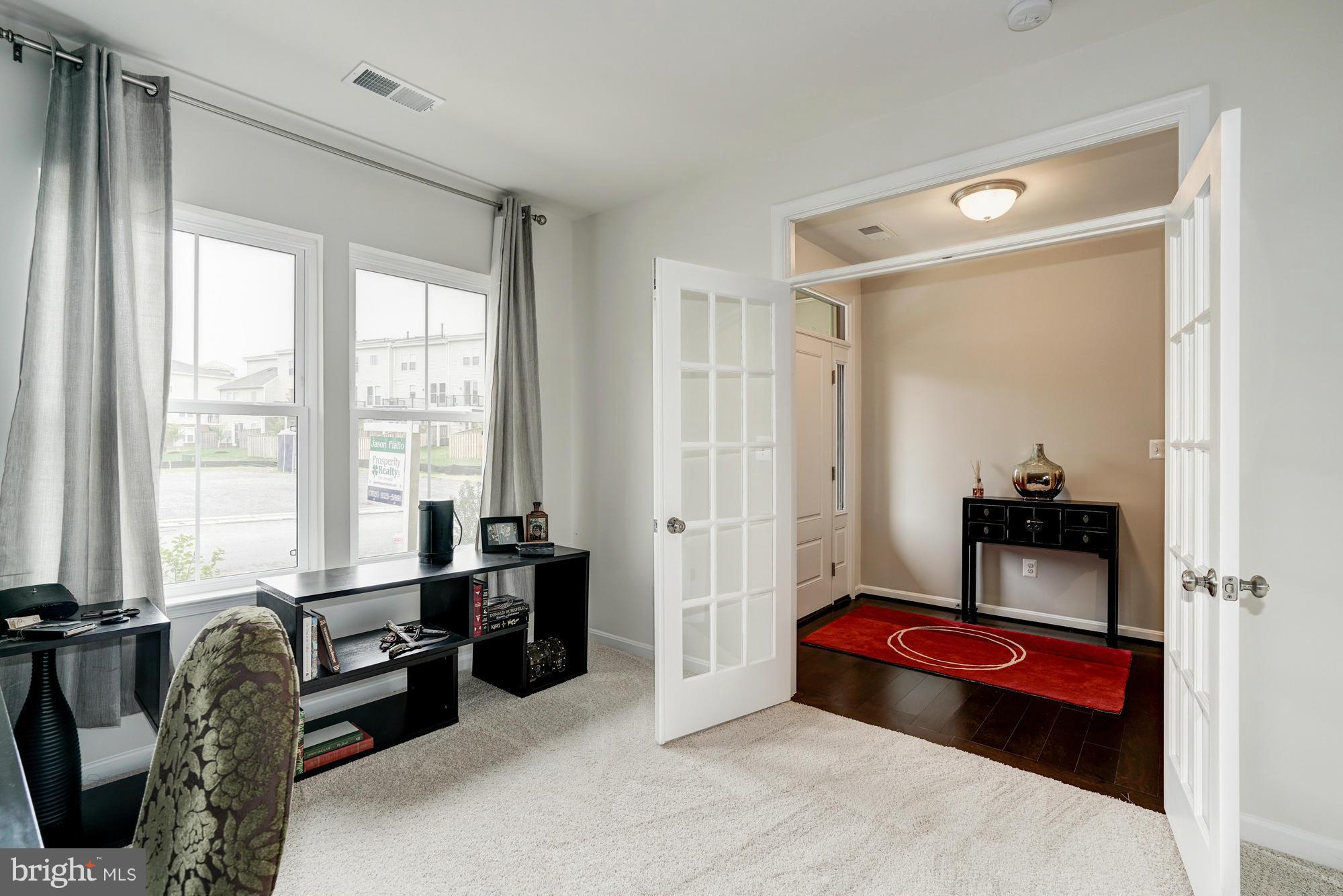 42277 Riggins Ridge Terrace Ashburn, VA 20148 - Photo 5 of 30 a bedroom with furniture and a window