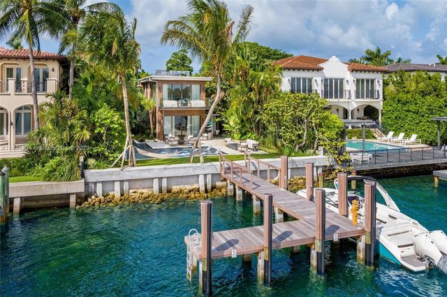 a view of a lake and outdoor seating