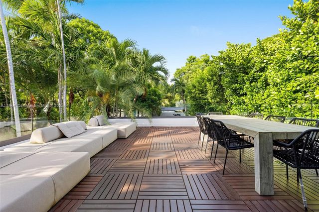 a view of swimming pool with chairs