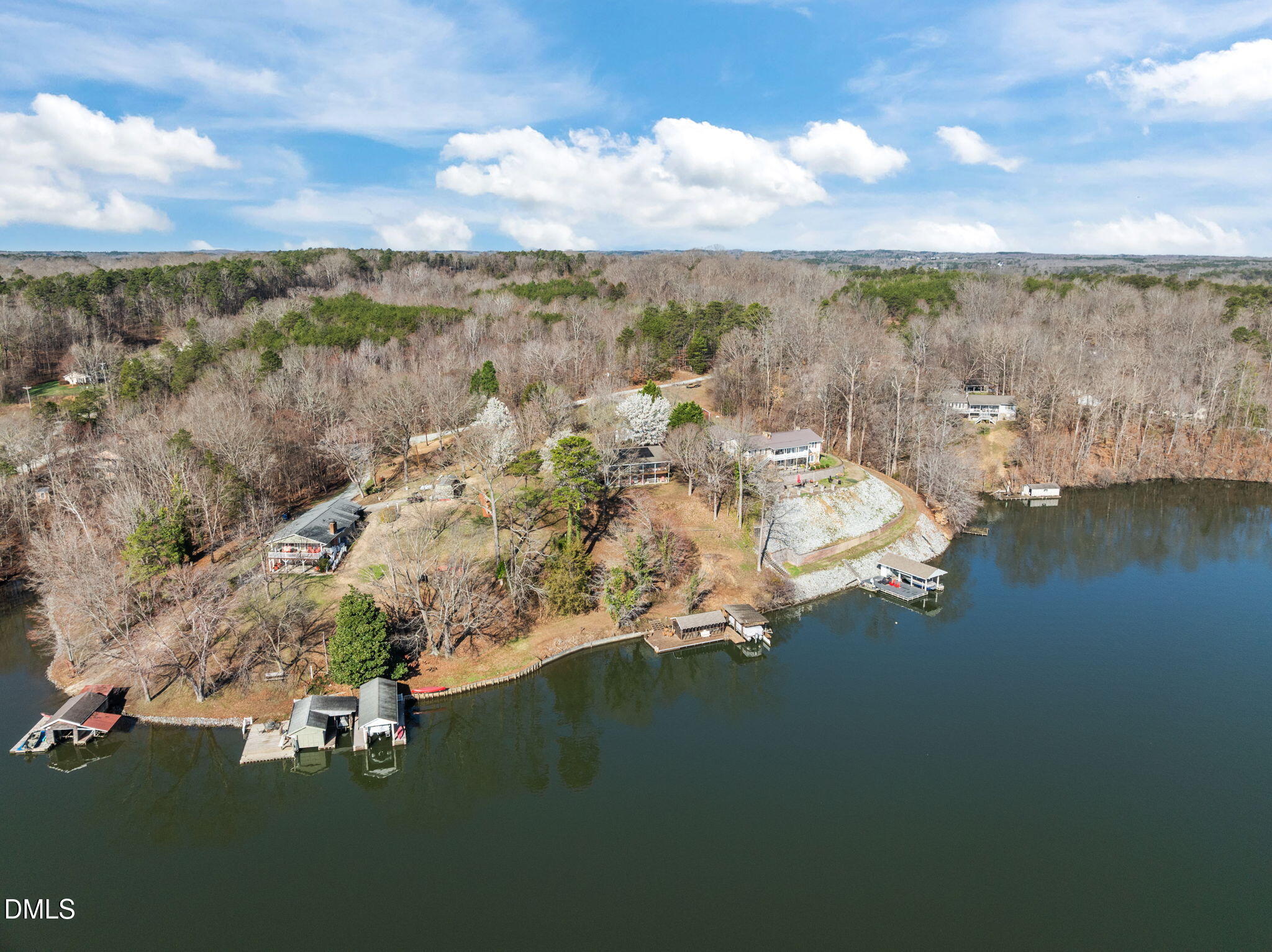 154 Spinnaker Lane Semora, NC 27343 - Photo 10 of 61 a view of a city with lots of residential buildings lake and mountain view