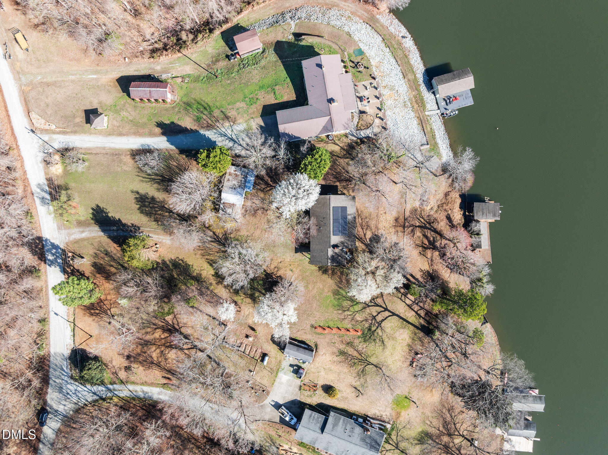 154 Spinnaker Lane Semora, NC 27343 - Photo 12 of 61 an aerial view of a house with a yard and large trees