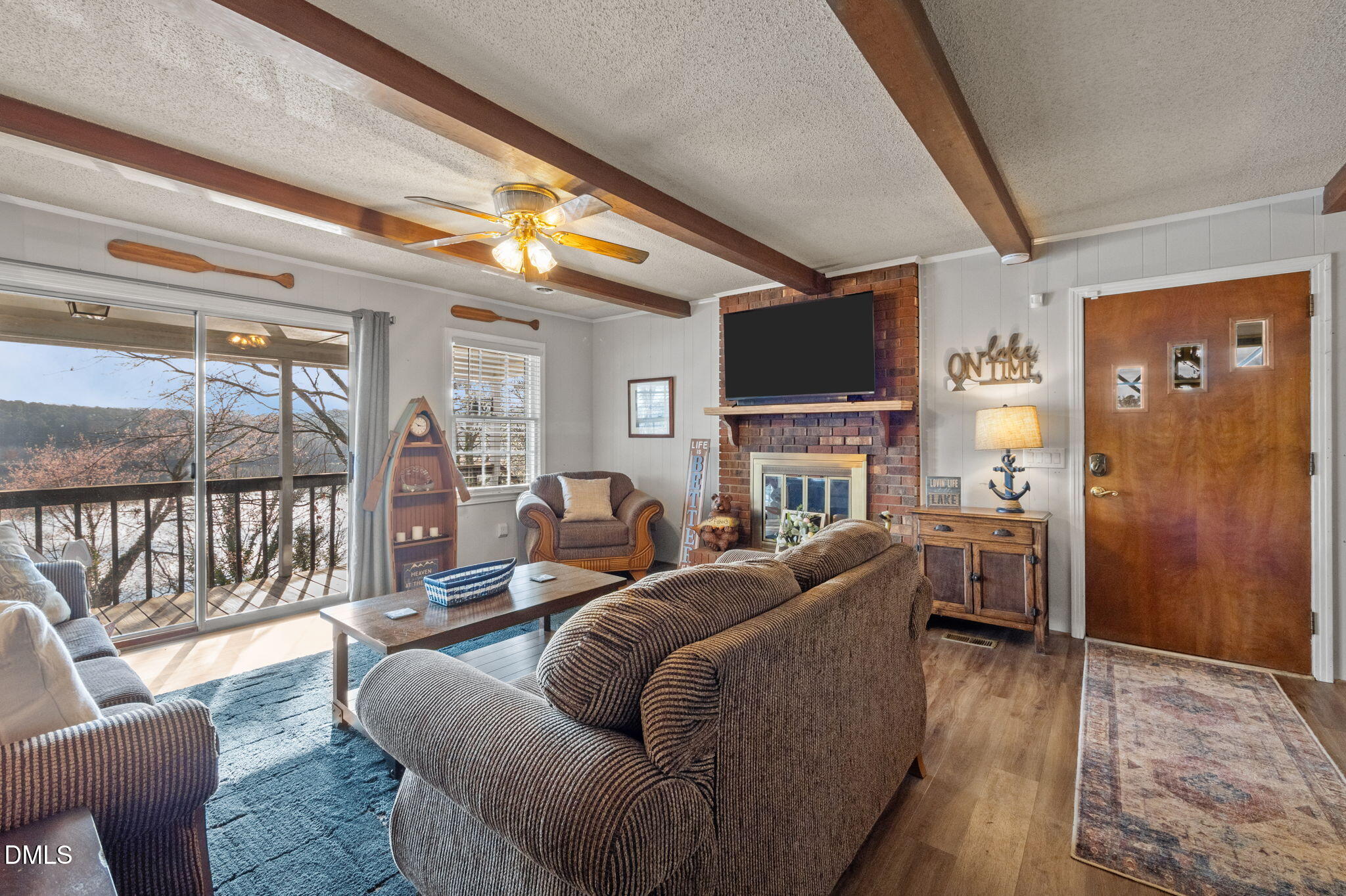 154 Spinnaker Lane Semora, NC 27343 - Photo 16 of 61 a living room with fireplace furniture and a flat screen tv
