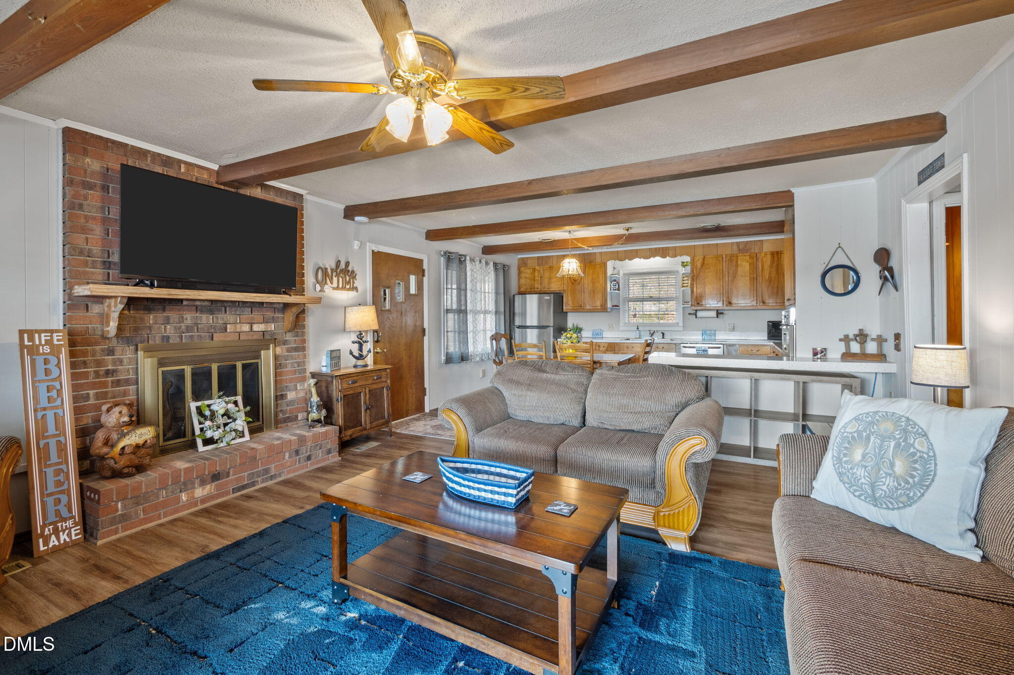 154 Spinnaker Lane Semora, NC 27343 - Photo 18 of 61 a living room with fireplace furniture and a flat screen tv