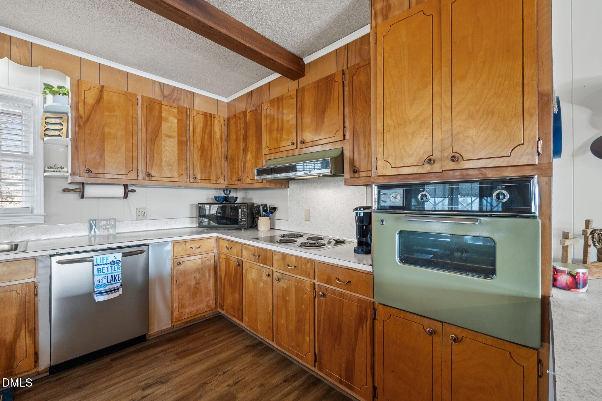 154 Spinnaker Lane Semora, NC 27343 - Photo 22 of 61 a kitchen with stainless steel appliances granite countertop a stove a sink and a microwave
