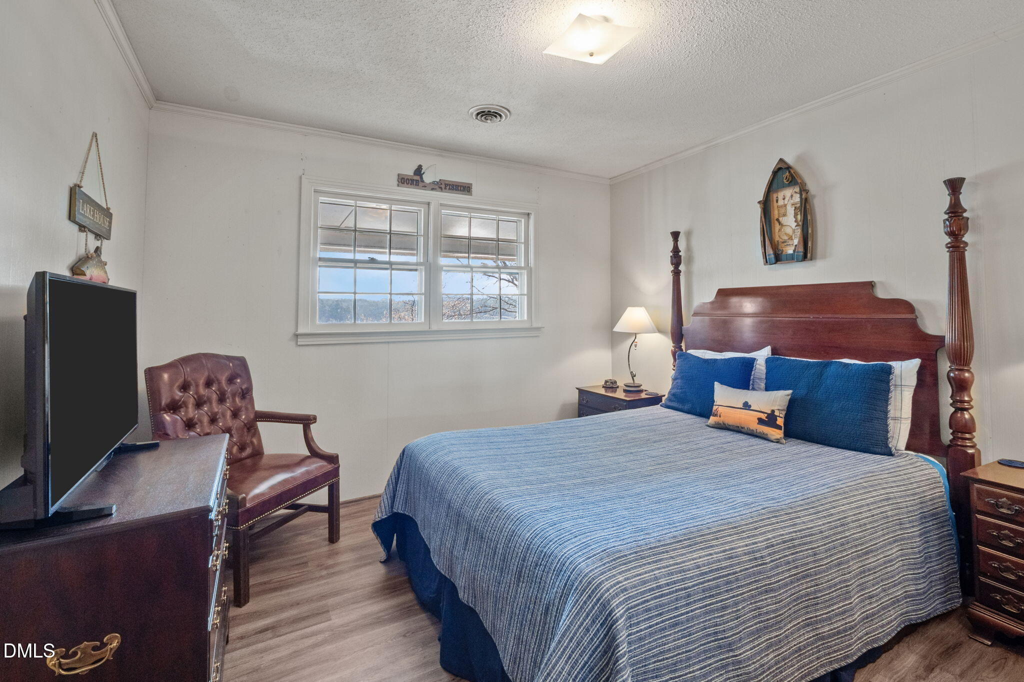 154 Spinnaker Lane Semora, NC 27343 - Photo 23 of 61 a bedroom with a bed chair and a window