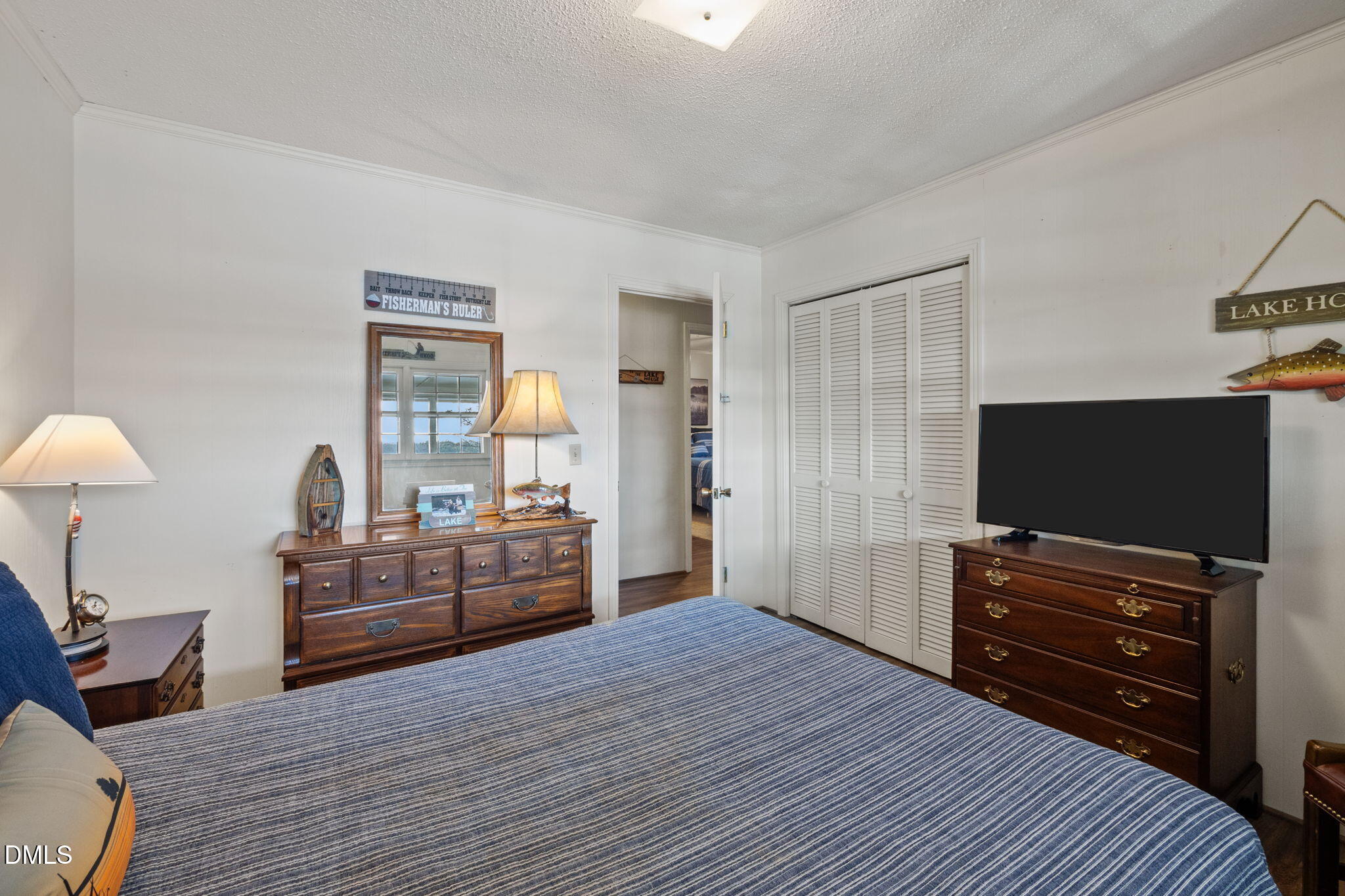 154 Spinnaker Lane Semora, NC 27343 - Photo 24 of 61 a bedroom with furniture and flat screen tv