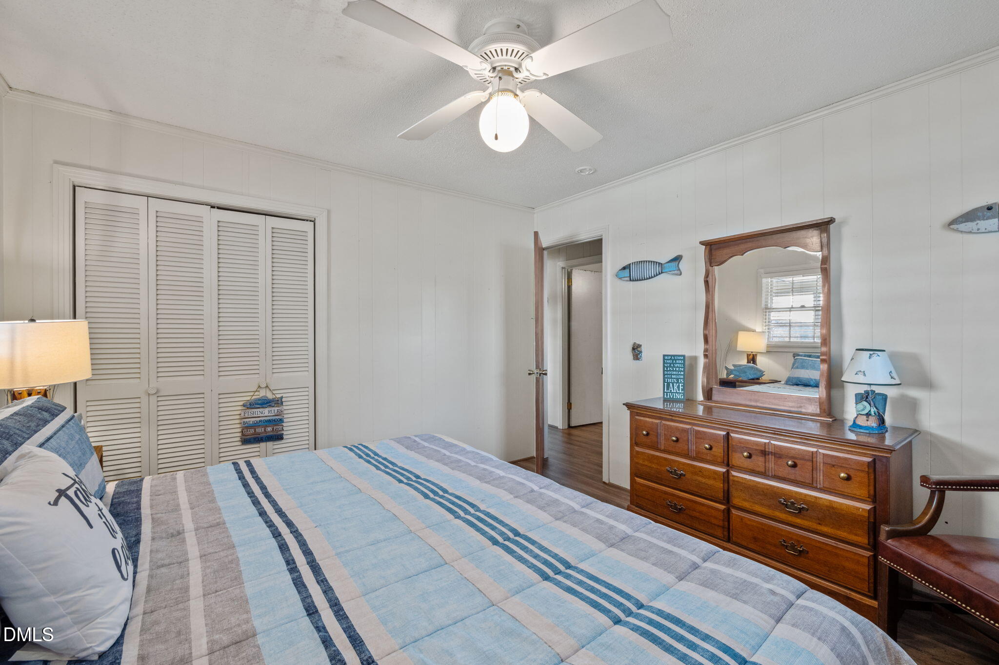 154 Spinnaker Lane Semora, NC 27343 - Photo 26 of 61 a bedroom with a bed and wooden floor