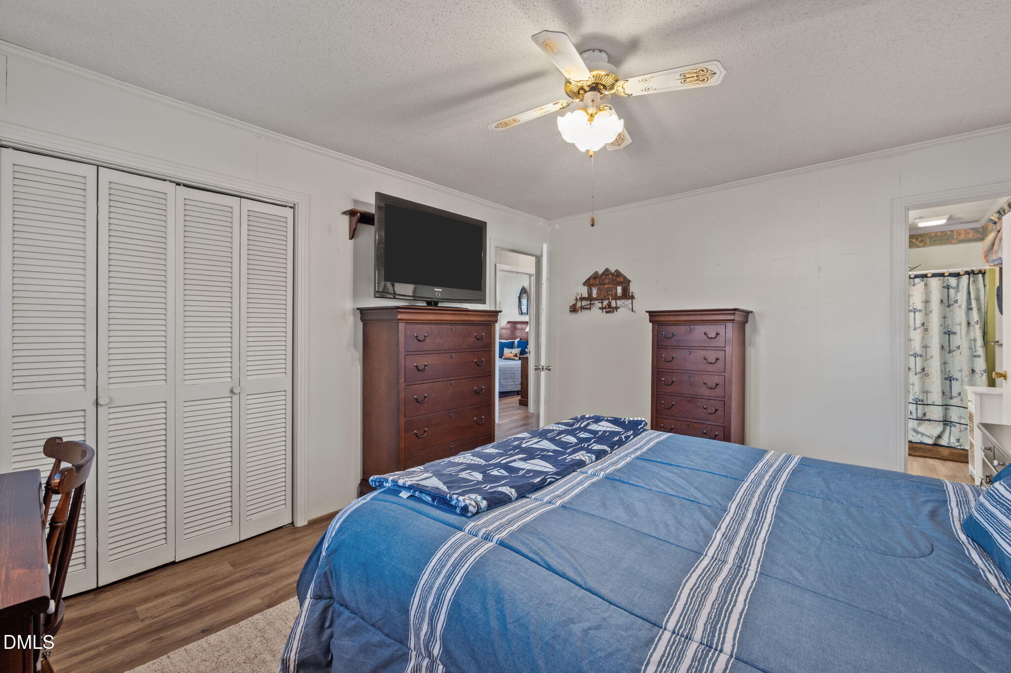 154 Spinnaker Lane Semora, NC 27343 - Photo 28 of 61 a bedroom with a bed and a flat screen tv