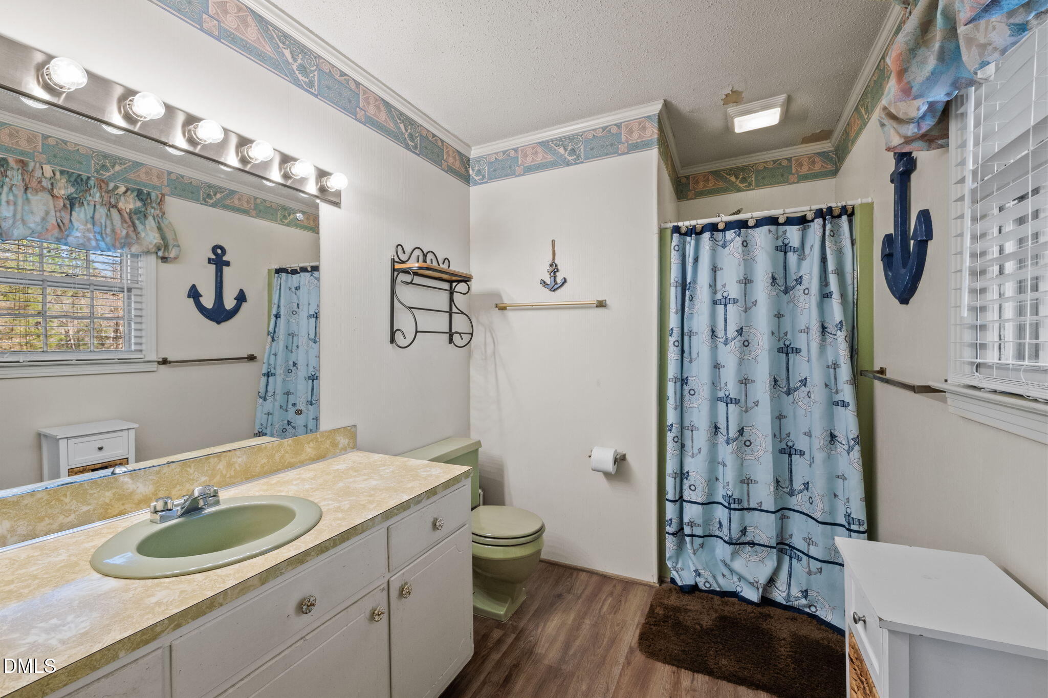154 Spinnaker Lane Semora, NC 27343 - Photo 29 of 61 a bathroom with a granite countertop sink a toilet a shower and a mirror
