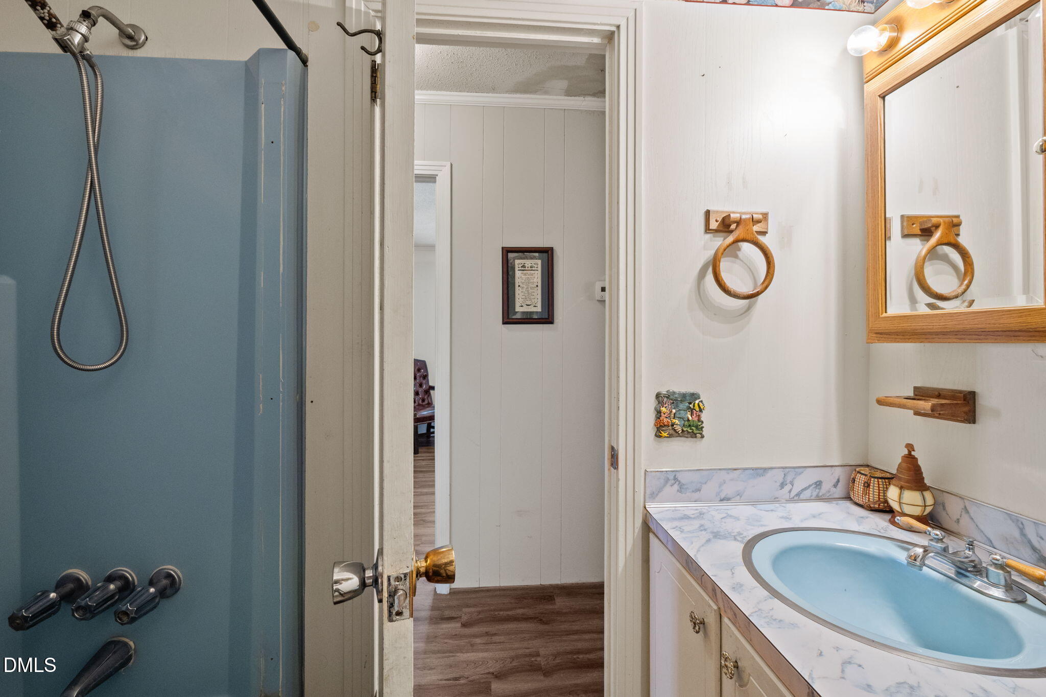 154 Spinnaker Lane Semora, NC 27343 - Photo 31 of 61 a bathroom with a sink and a mirror