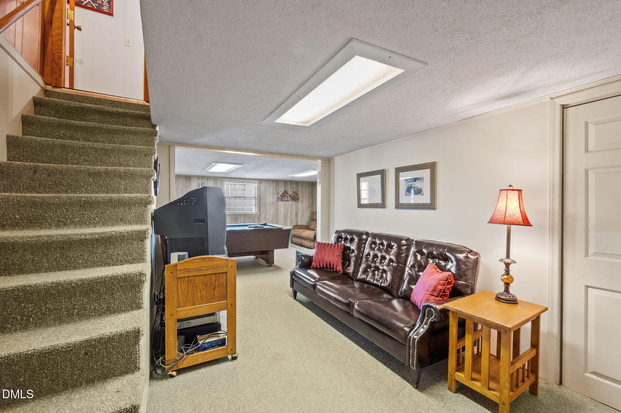 154 Spinnaker Lane Semora, NC 27343 - Photo 32 of 61 a living room with furniture and a painting
