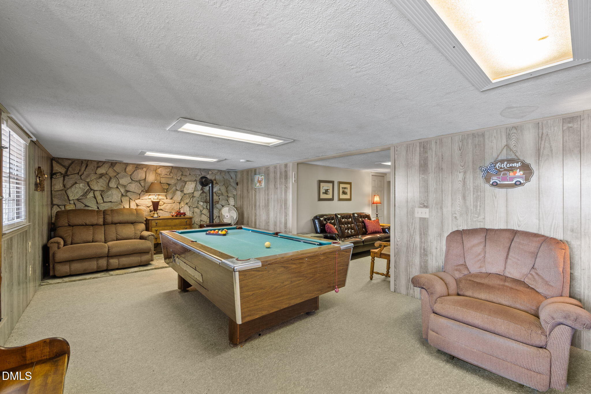 154 Spinnaker Lane Semora, NC 27343 - Photo 37 of 61 a living room with furniture and a flat screen tv