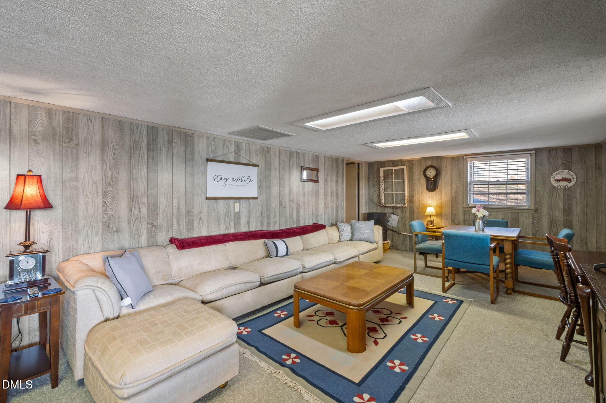 154 Spinnaker Lane Semora, NC 27343 - Photo 38 of 61 a living room with furniture a rug and a window