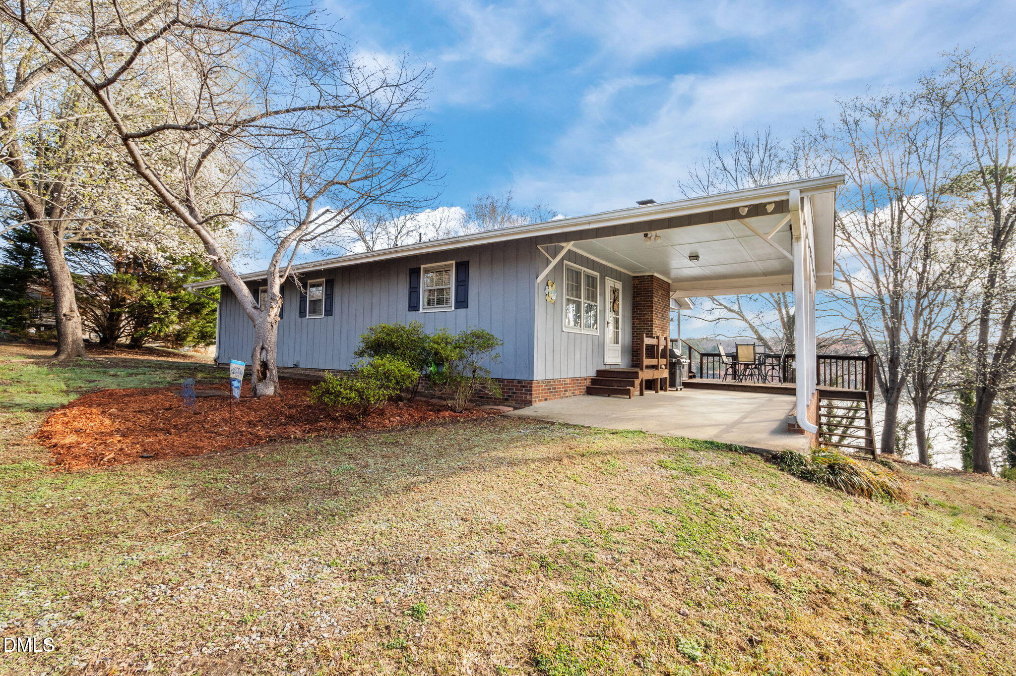 154 Spinnaker Lane Semora, NC 27343 - Photo 49 of 61 a view of a white house with a large tree and yard