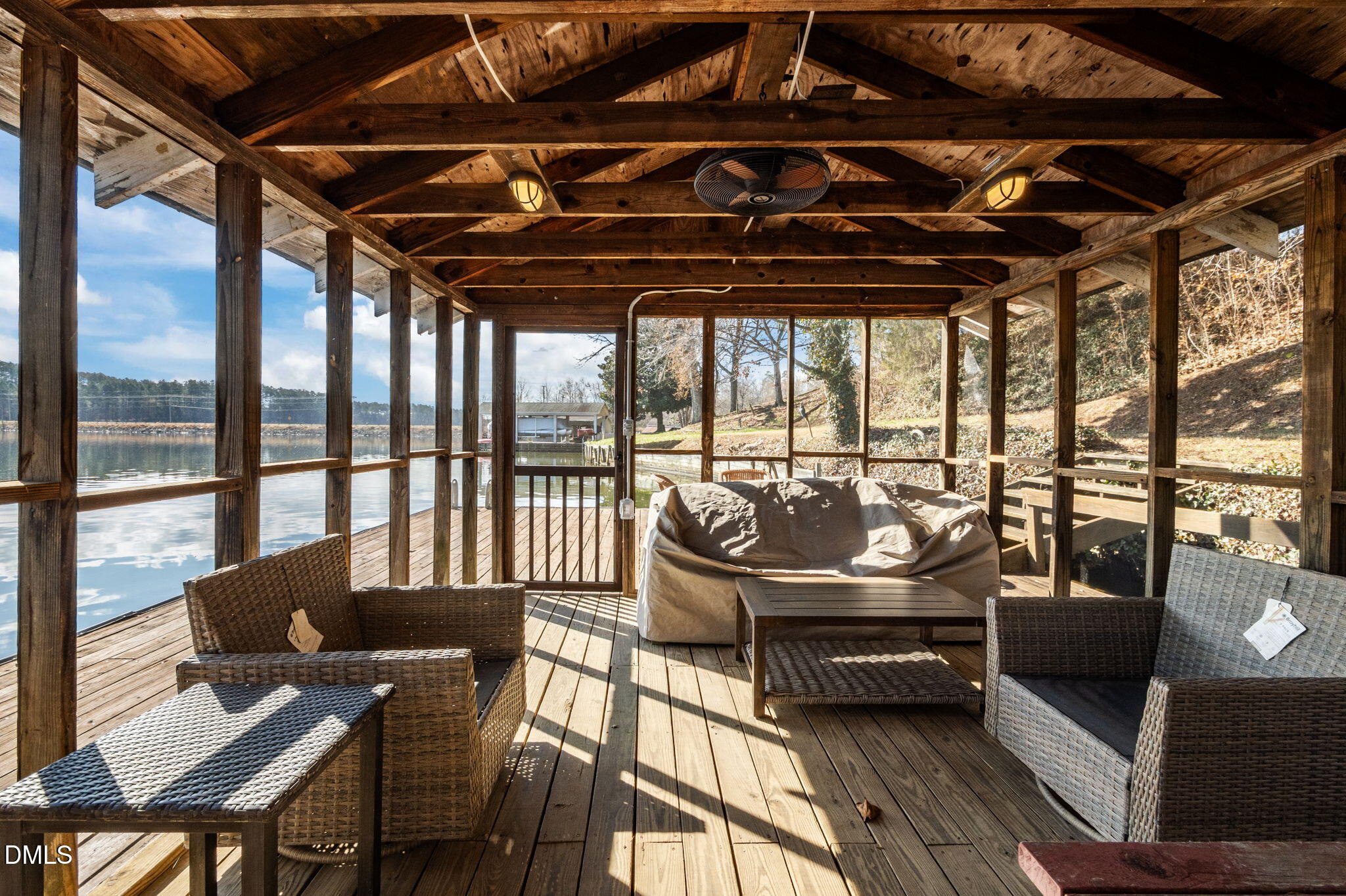 154 Spinnaker Lane Semora, NC 27343 - Photo 55 of 61 a living room with furniture and a floor to ceiling window