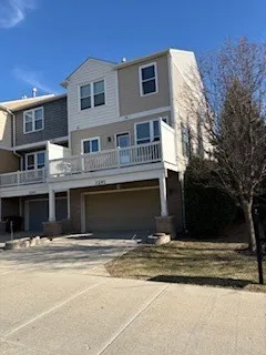 a view of the house with a yard