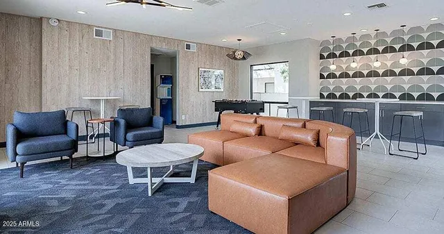 a living room with furniture and a large window