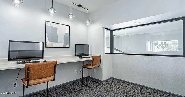 a room with furniture and a flat screen tv