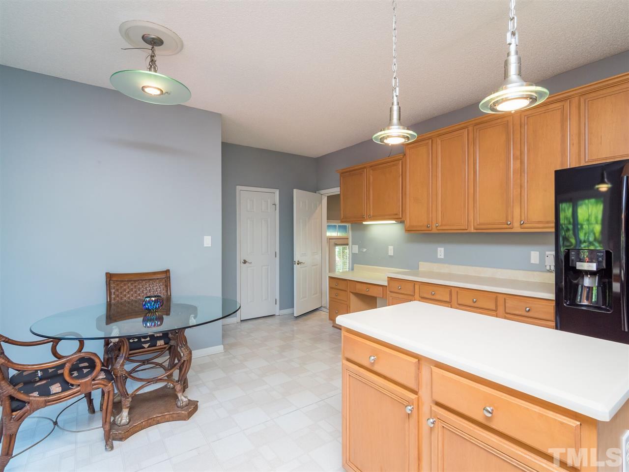 5604 Southern Cross Avenue Raleigh, NC 27606 - Photo 12 of 29 a kitchen with a sink cabinets and window