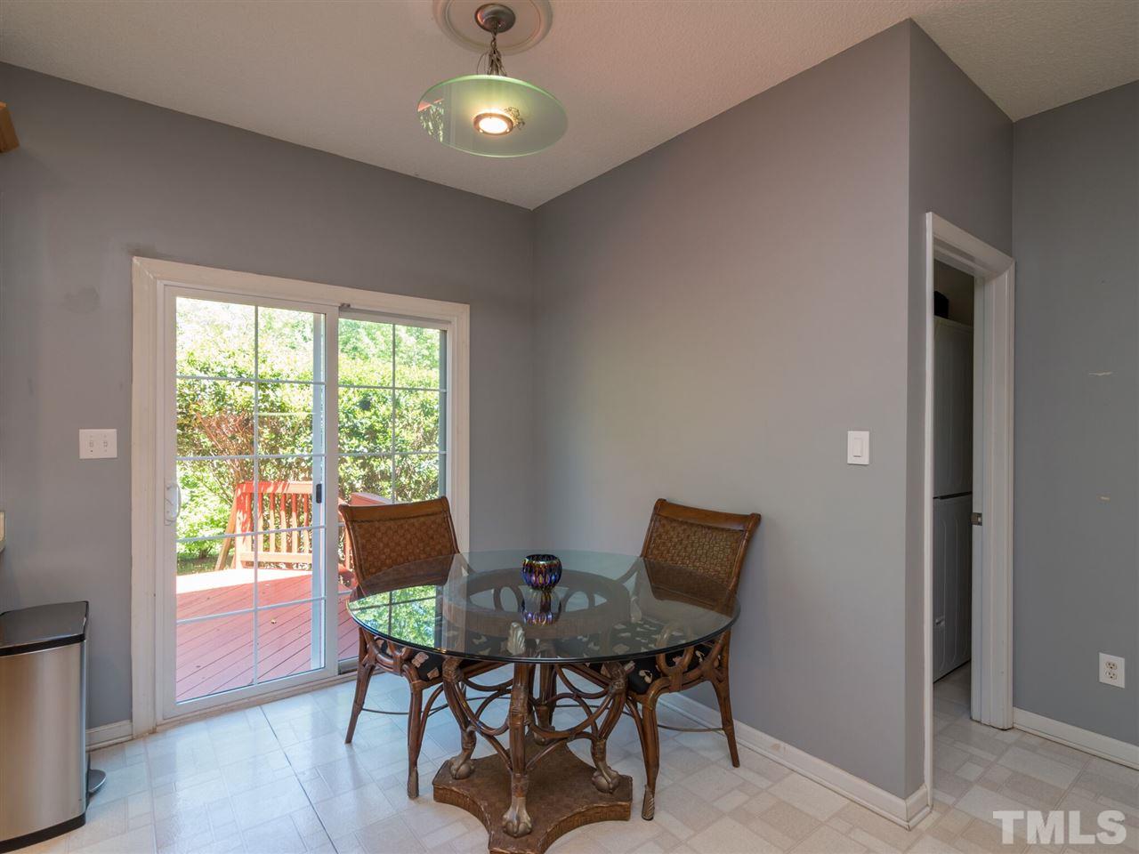 5604 Southern Cross Avenue Raleigh, NC 27606 - Photo 14 of 29 a view of a dining room with furniture and a window
