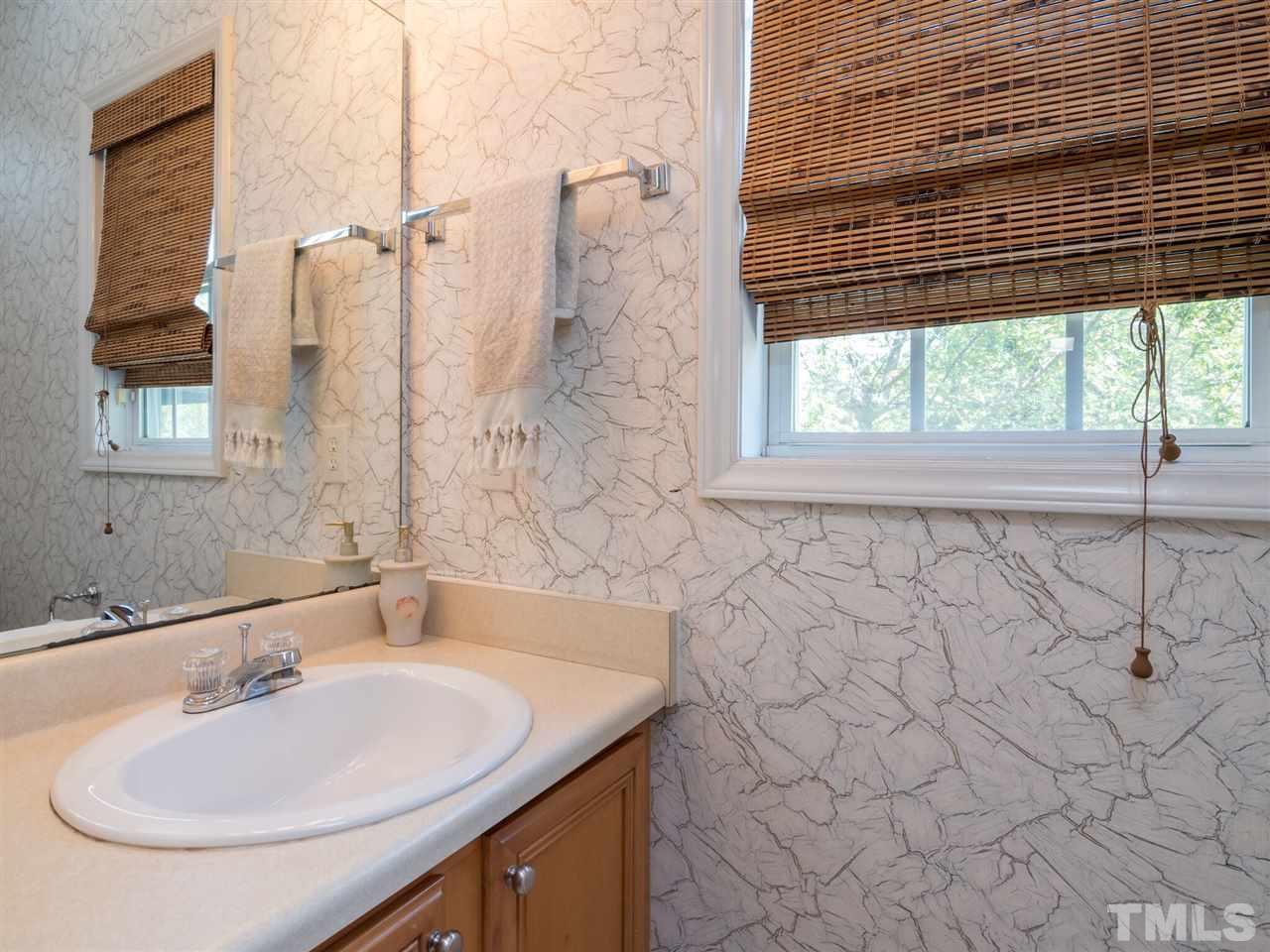 5604 Southern Cross Avenue Raleigh, NC 27606 - Photo 16 of 29 a bathroom with a sink and a bathtub