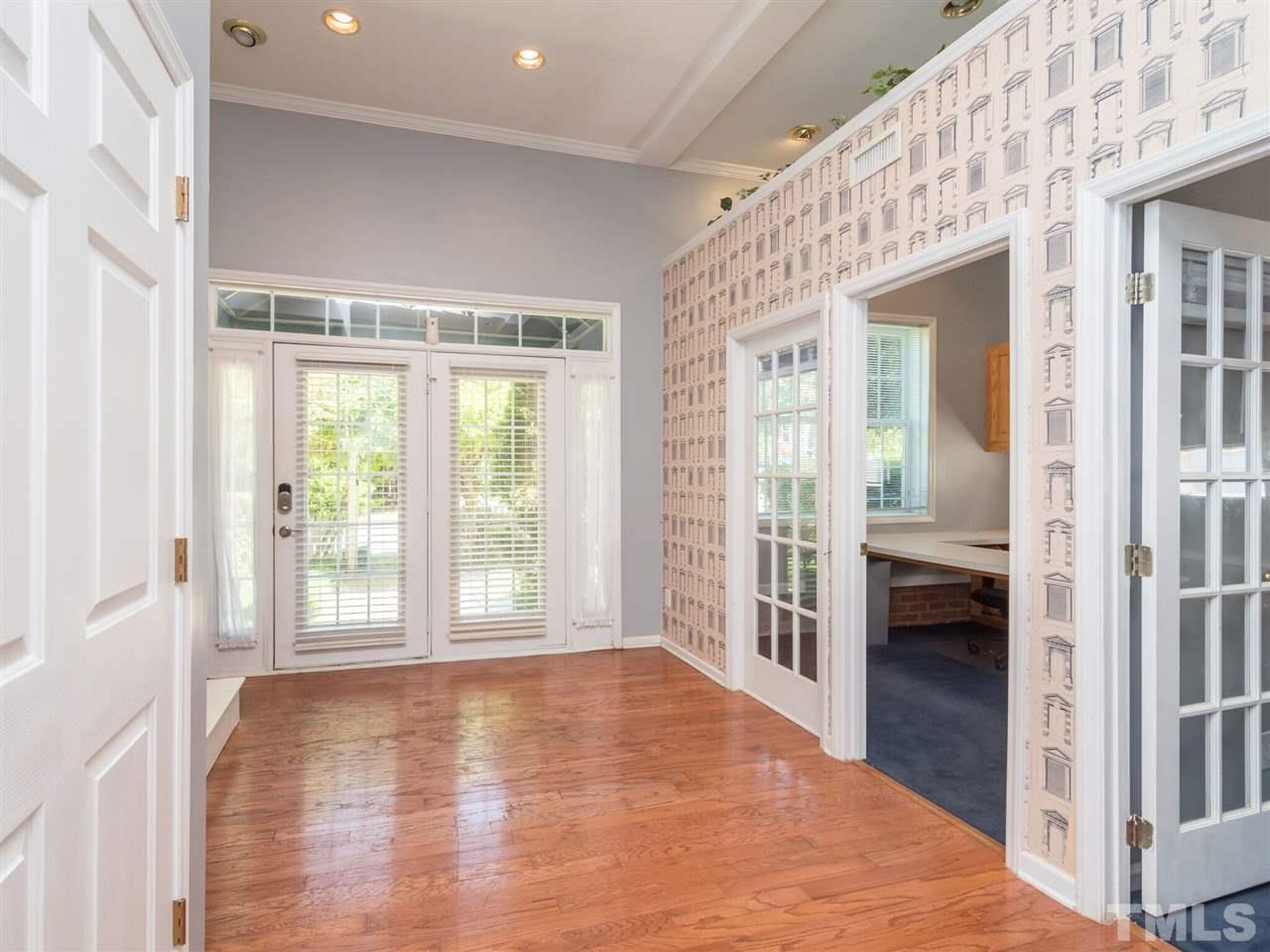 5604 Southern Cross Avenue Raleigh, NC 27606 - Photo 17 of 29 a view of a big room with wooden floor and windows