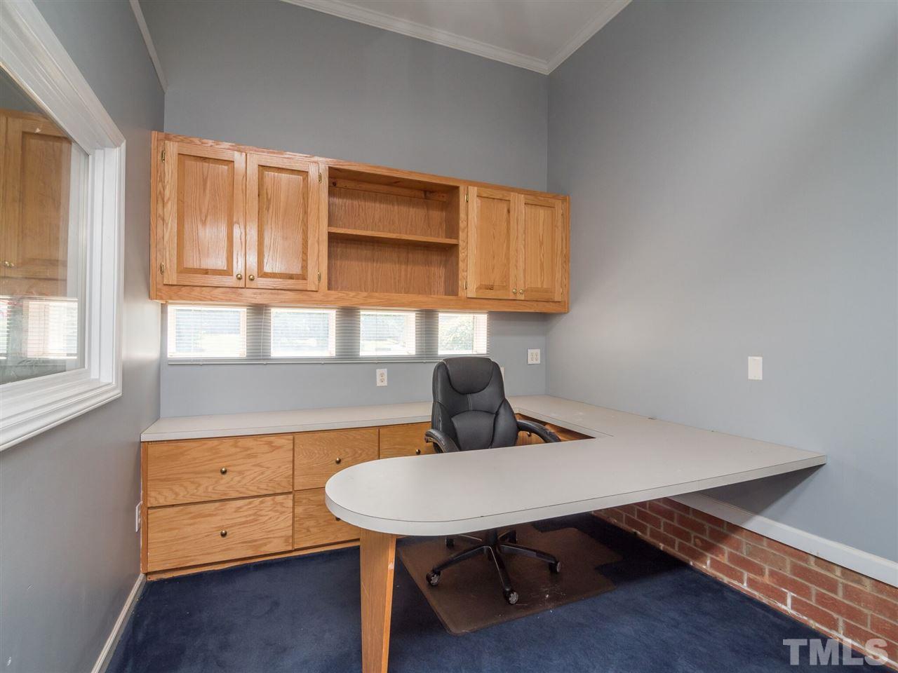 5604 Southern Cross Avenue Raleigh, NC 27606 - Photo 19 of 29 a view of a kitchen with a table and chairs in it