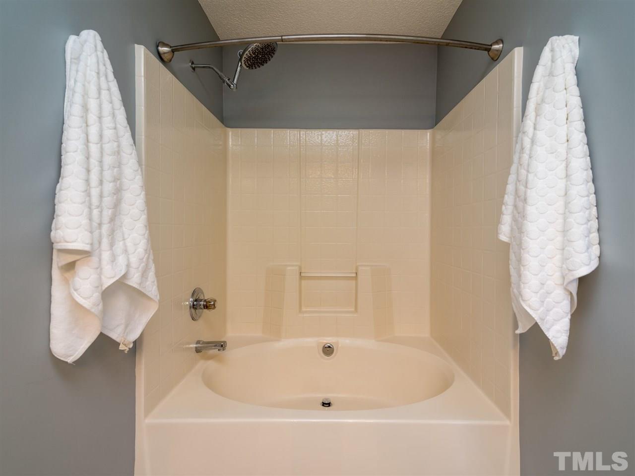 5604 Southern Cross Avenue Raleigh, NC 27606 - Photo 24 of 29 a bathroom with a bathtub and shower