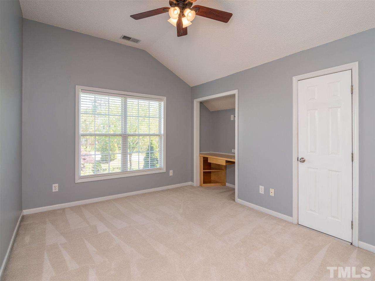 5604 Southern Cross Avenue Raleigh, NC 27606 - Photo 26 of 29 a view of a livingroom with a ceiling fan and window