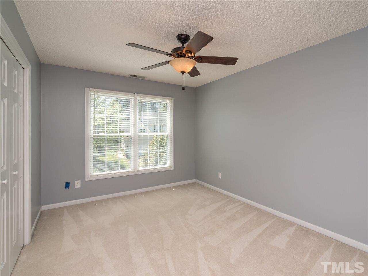 5604 Southern Cross Avenue Raleigh, NC 27606 - Photo 27 of 29 a view of a livingroom with a ceiling fan and window
