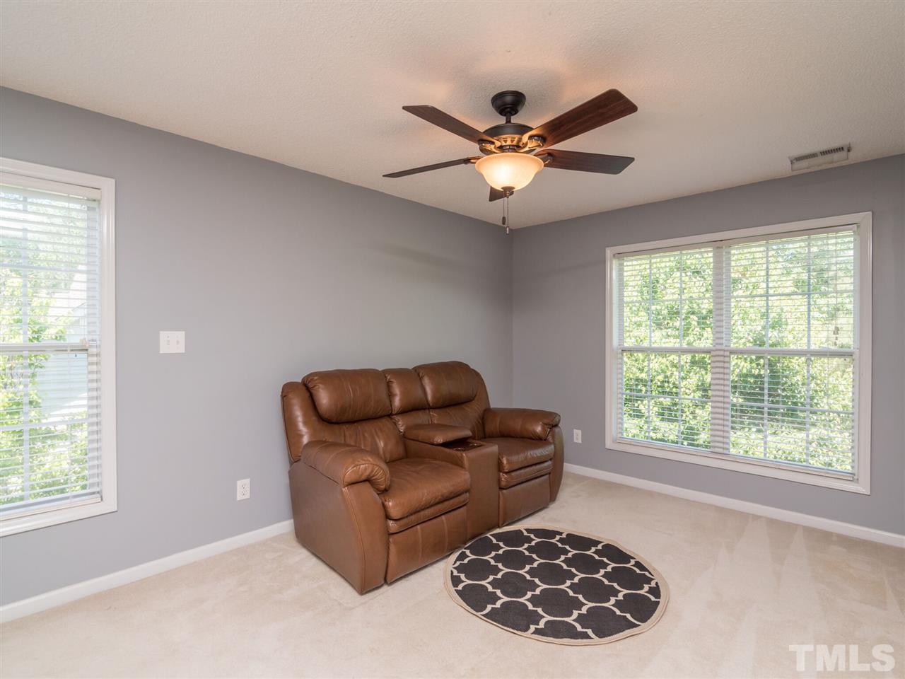 5604 Southern Cross Avenue Raleigh, NC 27606 - Photo 29 of 29 a living room with furniture and a window