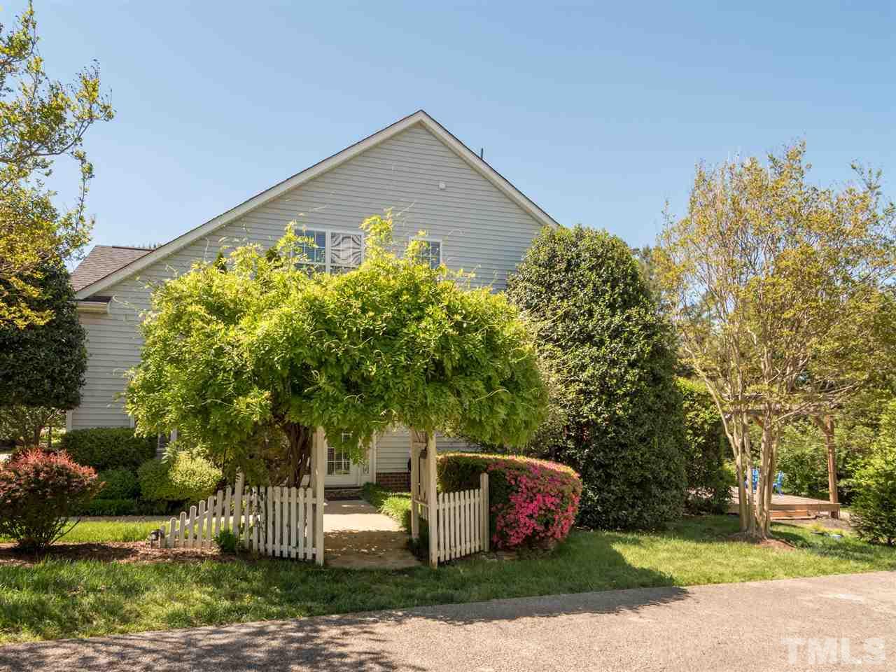 5604 Southern Cross Avenue Raleigh, NC 27606 - Photo 4 of 29 a front view of a house with garden