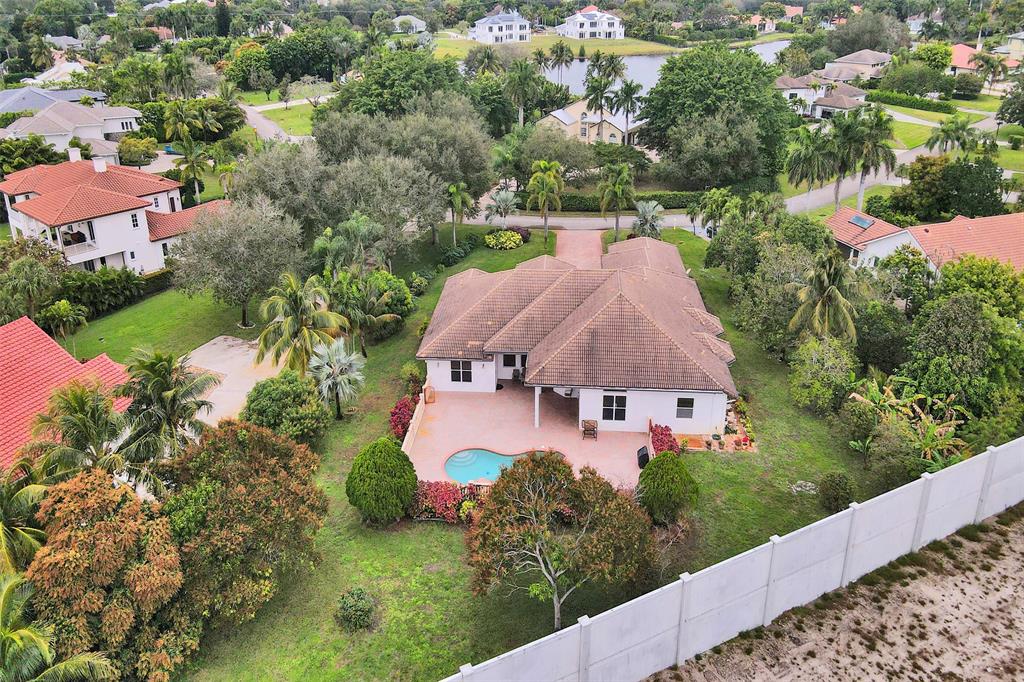 8426 Sawpine Road Delray Beach, FL 33446 - Photo 11 of 91 an aerial view of a house with yard swimming pool and outdoor seating