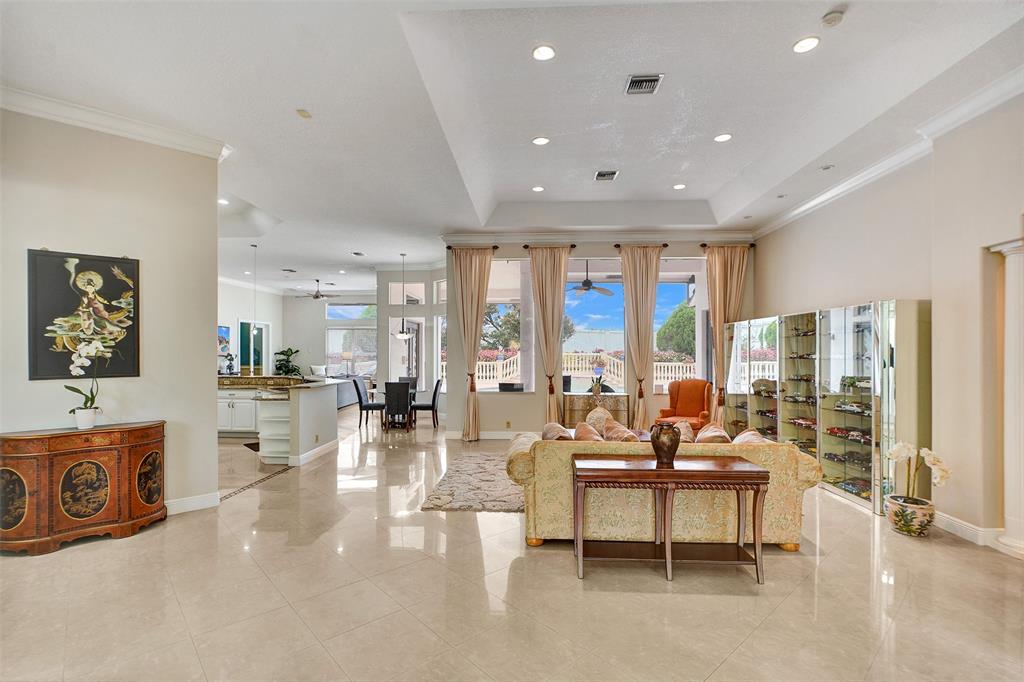 8426 Sawpine Road Delray Beach, FL 33446 - Photo 19 of 91 a living room with furniture and large windows