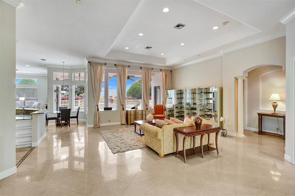 8426 Sawpine Road Delray Beach, FL 33446 - Photo 25 of 91 a living room with furniture and a large window