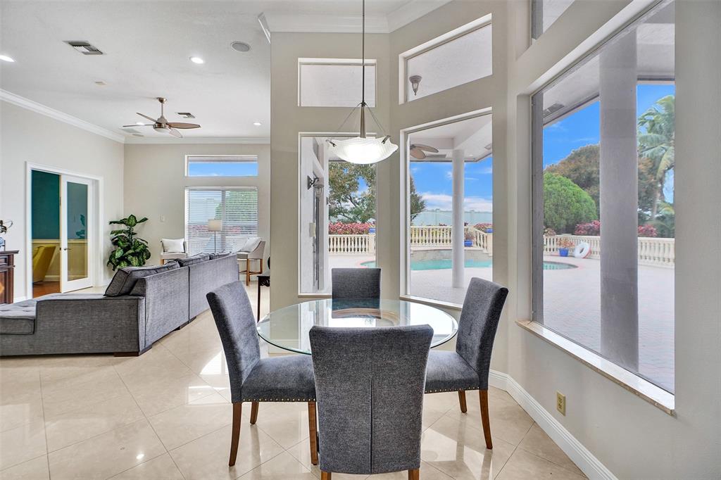 8426 Sawpine Road Delray Beach, FL 33446 - Photo 31 of 91 a view of a dining room with furniture window and wooden floor