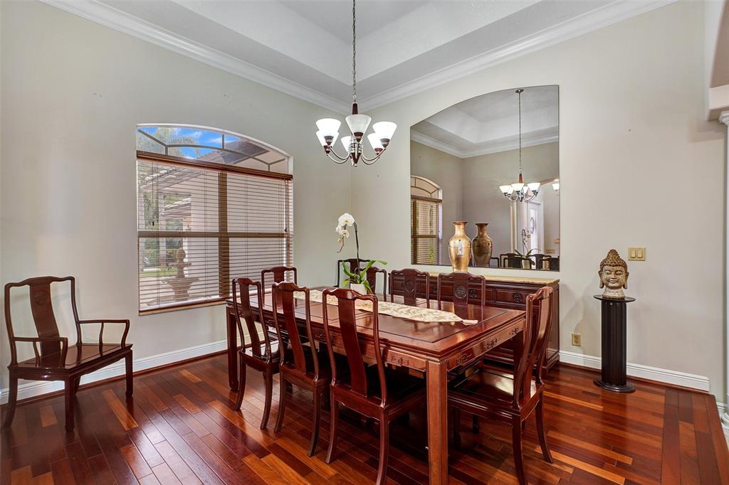 8426 Sawpine Road Delray Beach, FL 33446 - Photo 35 of 91 a view of a dining room with furniture window and wooden floor