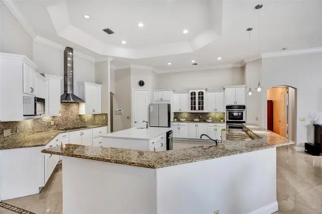a bathroom with a sink a vanity and a mirror