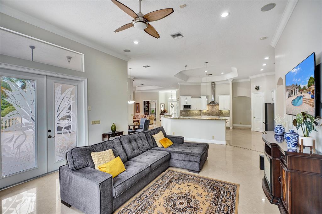 8426 Sawpine Road Delray Beach, FL 33446 - Photo 37 of 91 a living room with furniture and kitchen view
