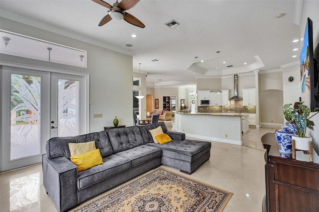 8426 Sawpine Road Delray Beach, FL 33446 - Photo 39 of 91 a living room with furniture and kitchen view