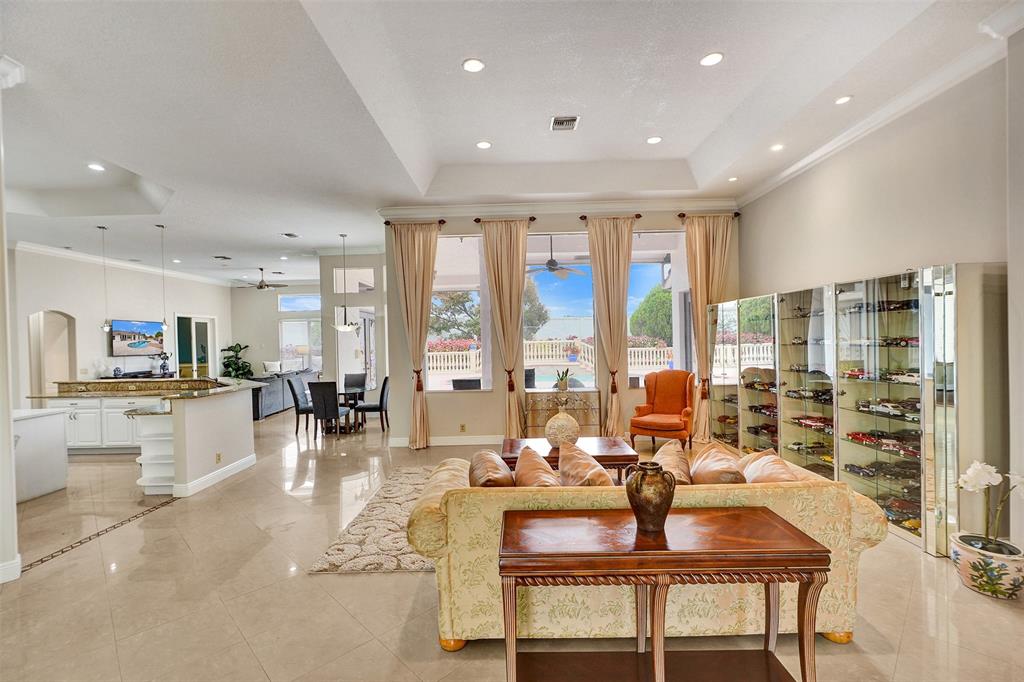 8426 Sawpine Road Delray Beach, FL 33446 - Photo 50 of 91 a living room with furniture and large windows