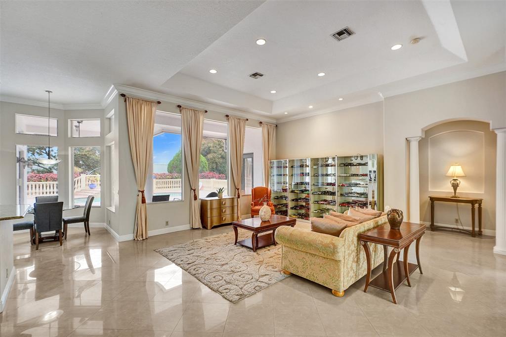 8426 Sawpine Road Delray Beach, FL 33446 - Photo 51 of 91 a living room with furniture and large windows