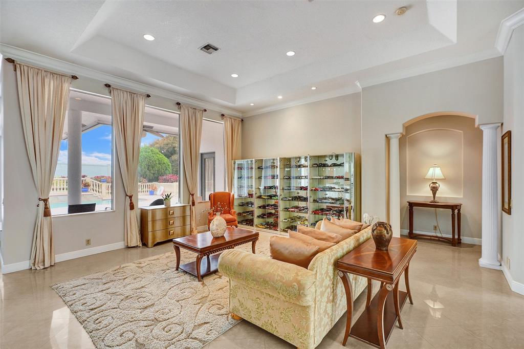 8426 Sawpine Road Delray Beach, FL 33446 - Photo 52 of 91 a living room with furniture and a floor to ceiling window