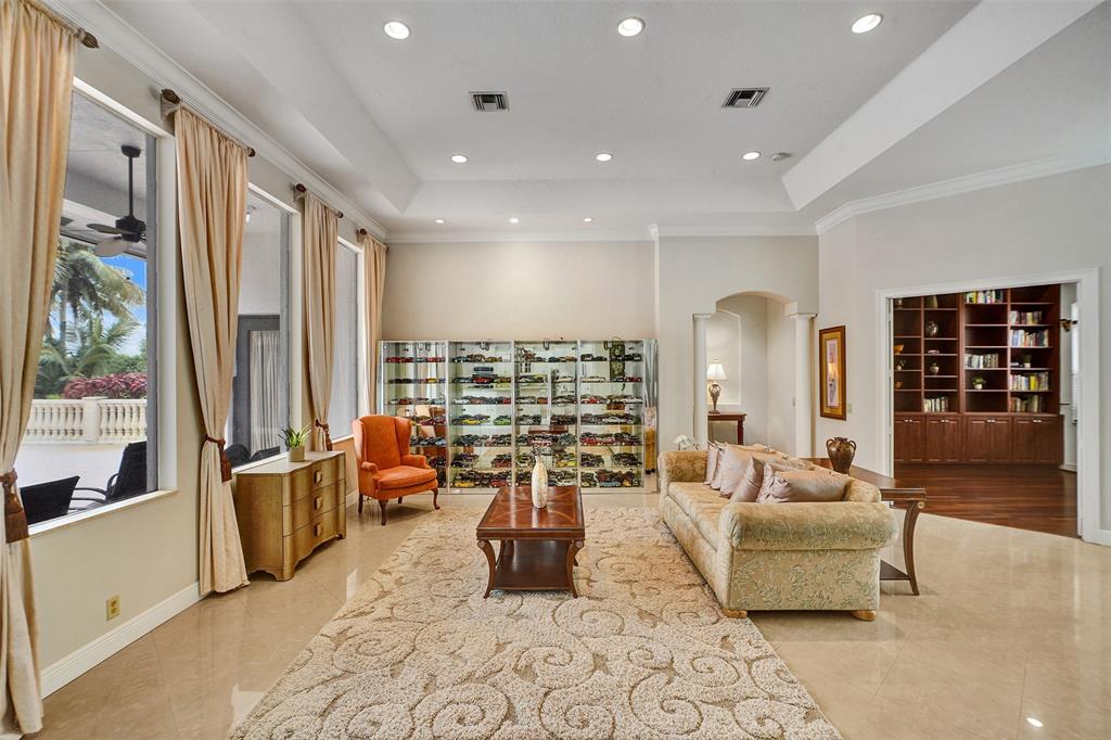 8426 Sawpine Road Delray Beach, FL 33446 - Photo 53 of 91 a living room with furniture large window and flat screen tv